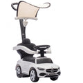 Baltas vaikiškas automobilis-stumdukas su stogeliu ir juoda sėdyne baltame fone
