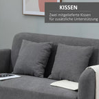 Pilka sofa su dviem pridedamomis pagalvėmis