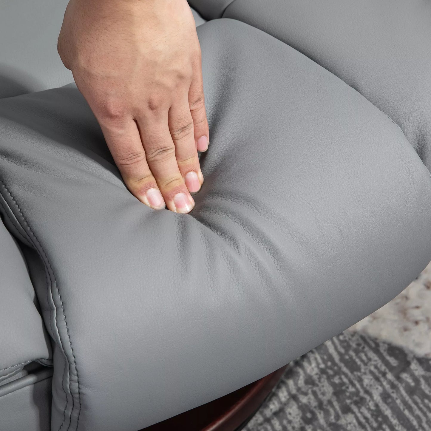 Besisukantis relaksacinis krėslas su pakoja, reguliuojama atlošo padėtimi, odos imitacijos, iki 130 kg, pilkas