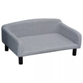 Šviesiai pilka aksominė šunų sofa su atlošu ir medinėmis kojelėmis