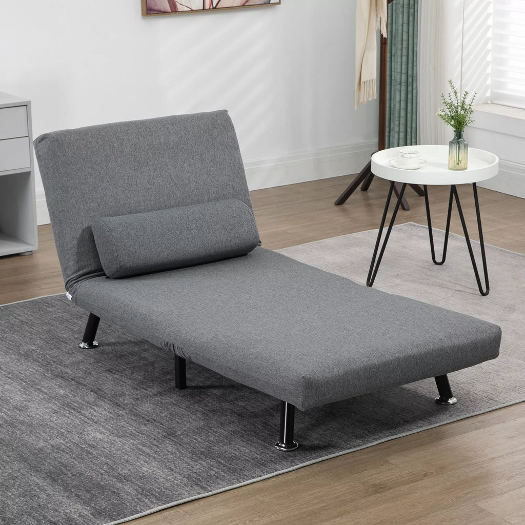 Tamsiai pilka sofa-lova išskleista į lovą kambaryje