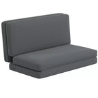 Tamsiai pilka sulankstoma grindų sofa baltame fone