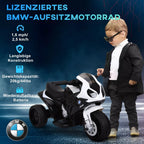 Vaikas prie licencijuoto juodai balto BMW elektrinio motociklo