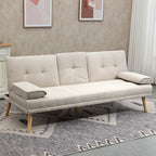 Smėlio spalvos sofa-lova šviesiame svetainės kambaryje su paveikslais