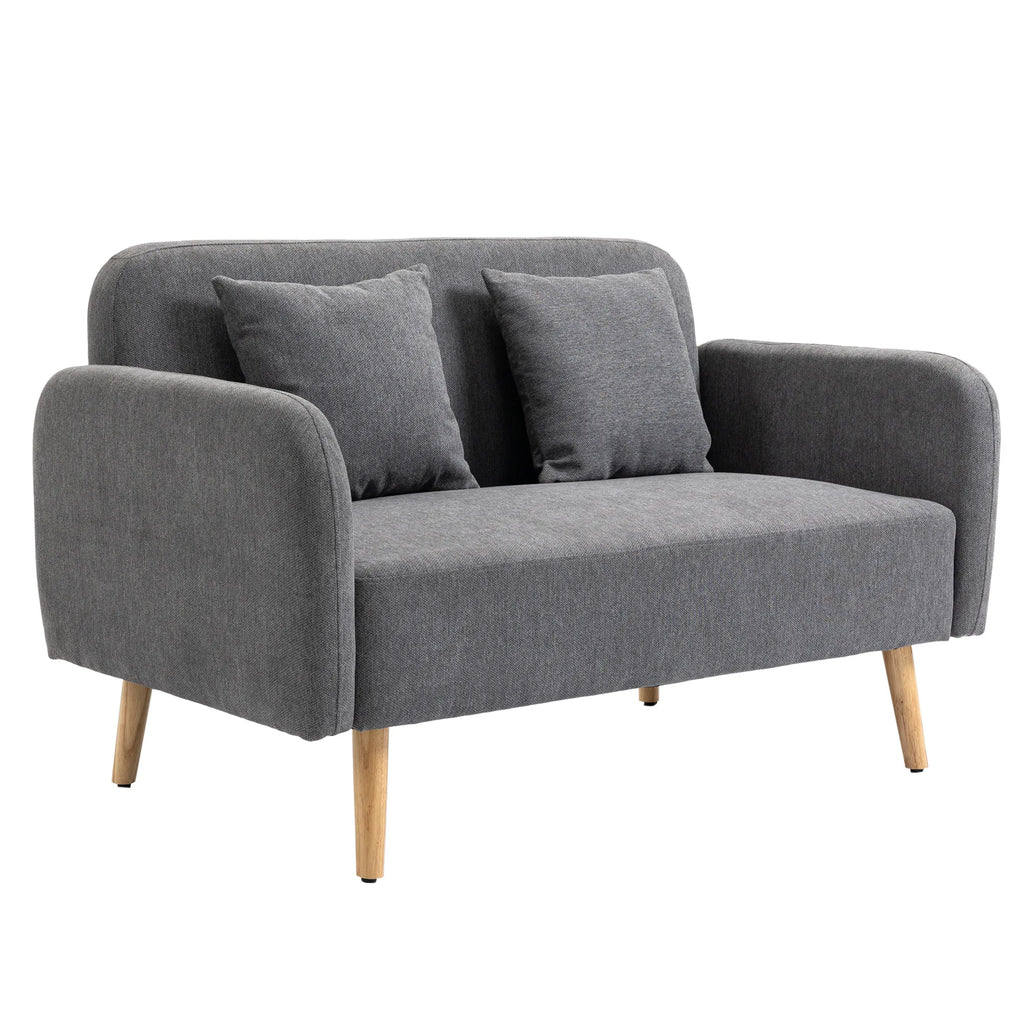 Pilka dvivietė sofa su pagalvėlėmis, vaizdas iš kito rakurso