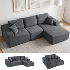 Tamsiai pilka kampinė sofa modernioje svetainėje šalia šviesaus kilimo ir šviestuvo