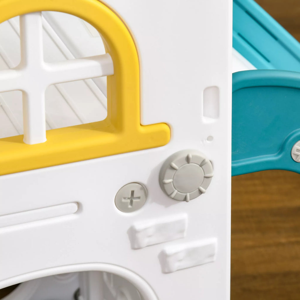 Geltona laiptinės ir čiuožyklos detalė su apvaliais langais