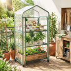 Šiltnamis ant medinės terasos šalia sodo įrankių spintelės