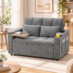 Sudėta pilka sofa su išlankstomu staliuku, knyga ir gėrimu svetainėje