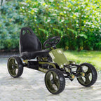 Žalias pedalinis kartingas lauke ant žolės, priekinis kadras kampu