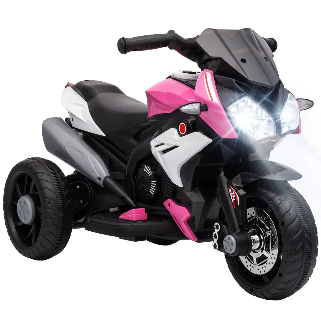 Rožinis vaikiškas elektromotociklas su trimis ratais ir įjungtais žibintais