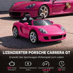 Rožinis Porsche elektromobilis šalia tikro sportinio automobilio fono