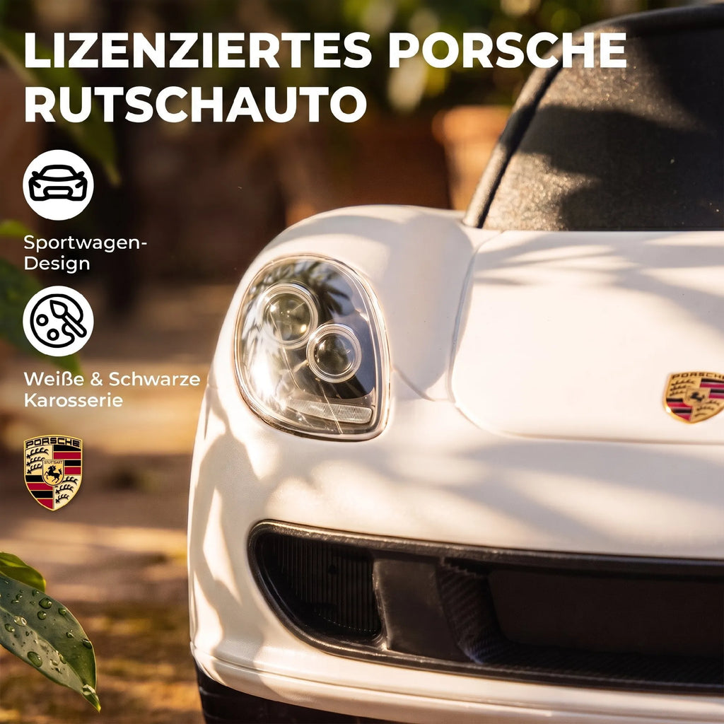Automobilio priekinis žibintas ir Porsche ženkliukas artimu planu