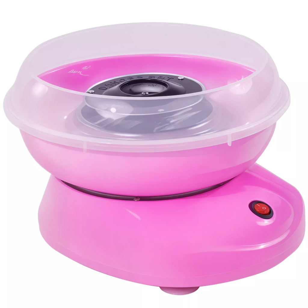 Rožinis cukraus vatos aparatas su skaidriu dangteliu ant balto fono